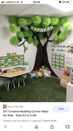 an office decorated with green tissue paper trees