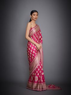 Editor's Note This set features a fuchsia floral/tropical saree with an unstitched blouse. Fabric: Silk Satin Components: Sari and unstitched blouse Care: Dry Clean Only About the DesignerRi Ritu Kumar is one of India’s foremost designers. She has developed a unique style of her own, reflecting the ancient traditions of Indian craftsmanship in a contemporary vocabulary. With a background in art history and museology, which has enriched her horizons, Ritu’s understanding of ancient designs and th Banarasi Silk Pre-draped Saree For Reception, Zari Weaving Choli For Reception, Pink Blouse Piece For Reception, Pink Pre-draped Saree With Zari Weaving For Reception, Pink Pre-draped Saree For Reception With Zari Weaving, Pink Self-design Pre-draped Saree For Reception, Pink Art Silk Blouse For Eid, Transitional Season Unstitched Saree, Pink Blouse With Zari Weaving For Reception