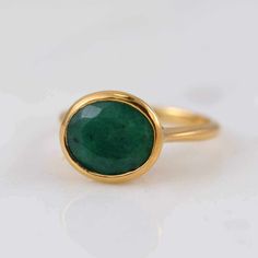 Wedding Emerald Ring Oval Cabochon With Polished Finish, Luxury Oval Gemstones With Stone Setting, Emerald Oval Cabochon Gemstone Rings, Emerald Bezel Set Oval Cabochon Ring, Classic Oval Gemstone With Bezel Setting, Classic Oval Bezel Set Gemstones, Classic Emerald Ring With Bezel Setting, Oval Cabochon, Classic Round Emerald Ring With Polished Finish, Oval Cabochon Rings For May Birthstone