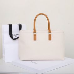 Size: 44cm*32cm*6cm It comes with Dust box, Care manual, Tag, and Paper bag. Large Capacity Rectangular Canvas Shopping Bag, Square Canvas Bag With Top Carry Handle For Errands, Large Rectangular Canvas Shopping Bag, Large Capacity Square Canvas Box Bag, Large Modern Beige Bag, Rectangular Canvas Bags For Shopping, Rectangular Canvas Shopping Bags, Large Rectangular Canvas Bags, Beige Canvas Box Bag For Shopping