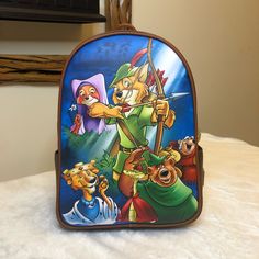 -Authentic, Brand New With Tags Loungefly Disney Robin Hood Mini Backpack -You Will Receive The Exact Bag Pictured -Super Cute, A Great Collectible For Robin Hood Fans! Would Make A Great Bag To Take To The Parks! -Comes From A Smoke Free, Pet Free Home. -I Ship Within 1-2 Days From Purchase. -Please Request For More Photos If Needed. -Check Out My Other Items! Minnie Mouse Games, Robin Hood Hat, Mermaid Backpack, Princess Backpack, Robin Hood Disney, Disney Enchanted, Backpack Organization, Enchanted Tiki Room, Disney Pixar Up