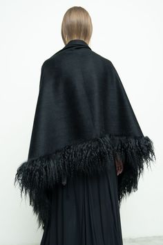 100% cashmere/ black fur/ black fringe Length: 30" x 73" including fur and fringe trim Chic Black Fur Coat With Feather Trim, Luxury Black Fur Coat With Feather Trim, Fall Evening Fur Coat With Feather Trim, Evening Fur Coat With Feather Trim For Fall, Elegant Black Sheepskin Fur Coat, Chic Black Sheepskin Fur Coat, Black Faux Fur Evening Coat, Black Faux Fur Coat For Evening, Evening Black Faux Fur Coat