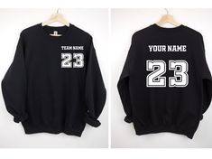 Custom Name and Number Sweatshirt, Personalized Sports Sweatshirt, Your Team Hoodie, Personalized Team Sweatshirt, Family Sport Sweatshirt SWEATSHIRT INFO: ☁️ 50% cotton, 50% polyester 🎉 Medium-heavy fabric (8.0 oz/yd² (271.25 g/m ✅ Loose fit 🧶 Sewn-in label 👌 Runs true to size DESIGN INFO: ▪️ Design is being implemented as DTF Technologies ▪️ There may at times be a slight difference between real and perceived colors of an item due to the nature of an item or resolution of a screen. CARE INS Black Long Sleeve Sweatshirt For Game Day, Fall Sports Team Sweatshirt, Fleece Long Sleeve Sports Sweatshirt, Long Sleeve Fleece Sweatshirt For Sports, Black Team Spirit Sweatshirt With Ribbed Cuffs, Team-colored Long Sleeve Sports Hoodie, Team-colored Long Sleeve Hoodie Sportswear, Team-colored Long Sleeve Sportswear Hoodie, Long Sleeve Hoodie With Team Name For Streetwear