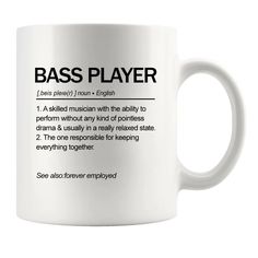 a white coffee mug with the definition of a bass player in black text on it