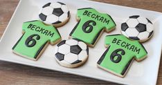 cookies decorated to look like soccer jerseys and balls with the number six on each cookie