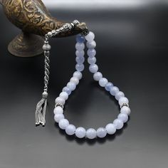 Real Blue Quartz Gemstone Rosary, Islamic Prayer 33 Beads, 925 Sterling Silver Prayer Beads, Rosary, Tasbih, Tesbih, Tasbeeh, Tasbih 33 ✦ Details ✦ * Material: 925 Sterling Silver * Gemstone: Blue Quartz * Bead : 33 Count * Bead Size: 10 mm * Silver weight: 13.00 grams * Total Length : 33 cm (13.00 Inches) ✦ Shipping ✦ * Processing time: 1-2 business days. * This item ships from my Turkish workshop in Istanbul. * Add your phone number in address box for a smoother delivery. That makes courier pe Silver Polished Round Beads, Gems, And Cabochons, Silver Round Beads With Natural Stones, Silver Beads With Natural Stones, Round Silver Beads With Natural Stones, Silver Beads, Gems, And Cabochons For Gifts, Silver Gemstone Beads And Cabochons, Silver Gemstone Round Beads, Spiritual Silver Beads With Natural Stones, Silver Beads Gems And Cabochons For Gifts