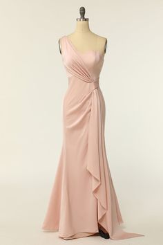 a pink dress on a mannequin dummy with the back draped in a ruffle