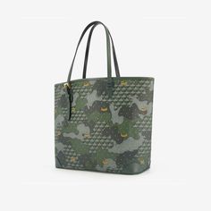 The Daily Battle bag, a Fauré Le Page icon, superbly combines craftsmanship with the finesse of the Maison’s signatures. This practical tote bag is designed to take on all the battles of everyday life and will stand the test of time. For this edition, the Scale Canvas blends into a verdant Camouflage pattern, like a game of hide-and-seek in a French Garden. The corners of the bag, in grained calfskin, are inspired by the corner reinforcements on hunting cases, while piping typical of military u Shopping Tote Bag With Case Included, Daily Use Satchel Tote With Case Included, Daily Use Tote Satchel With Case Included, Tote Bags With Case For Everyday Use, Luxury Large Capacity Shoulder Bag For Daily Use, Everyday Luxury Tote Satchel, Everyday Tote Bag With Case Included, Luxury Large Capacity Everyday Bag, Green Coated Canvas Satchel For Daily Use