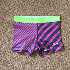 Never Worn Nike Shorts. Elastic Lime Green Band With Pink And Gray Spandex. 80% Polyester 20% Spandex Fitted Pink Activewear With Built-in Shorts, Pink Stretch Activewear For Swimming, Elastic Pink Sports Bottoms, Pink Elastic Sports Bottoms, Multicolor Stretch Yoga Shorts, Pink Stretch Sportswear Shorts, Pink Stretch Athleisure Shorts, Pink Elastic Short Bottoms, Fitted Pink Athletic Shorts