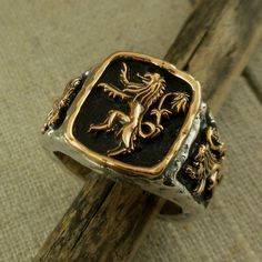 Sterling Silver and Bronze Petrichor Scottish Lion Rampant Signet Ring Size: 7 mm x 5 mm, tapers to 6 mm at back. Size: 10.5 is 20.9 grams. Sizes 8 - 15 whole and half. Petrichor Scottish Lion Signet Ring by Keith Jack Imported from Canada Signed by the Artist Boxed. Ships in 3 to 5 days Size 10.5 In Stock! Ships Immediately. Size 10.5 is 20.9 grams Gift Boxed with cleaning cloth. Luxury Vintage Signet Ring With Coat Of Arms, Luxury Yellow Gold Signet Ring With Coat Of Arms, Wolf Signet Ring, Luxury Yellow Gold Coat Of Arms Signet Ring, Rings Signet, Scottish Lion, Lion Signet Ring, Lion Ring, Gold Jewellry