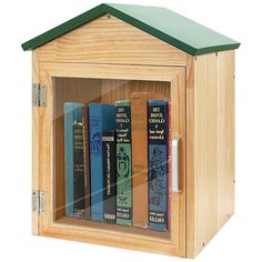 a wooden book case filled with books on top of a white background and green roof