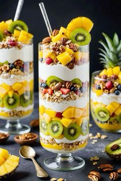 fruit and yogurt parfait dessert in glass cups with spoons