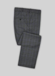 Take a fashion-forward stance by donning our exquisite Scabal Quart Checks Gray Wool Suit. Meticulously crafted from a wool-rich fabric, its gray base color exudes a sense of formality, while the tasteful colored checkered design in shades of blue adds a delightful pop of color, infusing a touch of playfulness into your look. This ultimate tailored suit effortlessly delivers a classic and timeless appearance, making it perfect for both formal events and professional workdays. 
  Look Includes Gray Wool Suit For Business Casual, Gray Semi-formal Suit For Fall, Semi-formal Gray Suit For Fall, Elegant Gray Winter Suits, Timeless Gray Wool Suits, Gray Formal Suit For Fall, Fitted Gray Winter Suit, Elegant Fitted Gray Suit, Elegant Gray Wool Suit