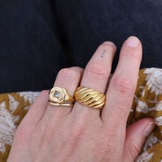 Whether worn as a standalone statement piece or stacked with other rings for a bolder look, the Striated Gold Ring effortlessly complements any ensemble, from casual to formal. 18kt gold plated stainless steel Color variations may exist compared to the jewelry photographed. Everyday Yellow Gold Metal Ring, Everyday Yellow Gold Rings, Gold Wide Band Ring Tarnish Resistant For Everyday, Everyday Metal Rings With Polished Finish, Everyday Gold Wide Band Ring, Tarnish Resistant, Elegant Gold Signet Ring, Classic Everyday Metal Rings, Gold Wide Band Jewelry For Everyday, Gold Open Ring For Everyday