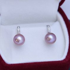 Freshwater pearls shimmer with very light overtones and classic purple body color seamlessly forming a single row of style distinction--an elegant look that only pearls can truly offer, setting them apart from any other gemstone or fine jewelry design. Materials: AAAA Freshwater Pearls, Size9-10mm, 925 sterling silver A FREE luxury jewelry box is included for high-quality pearl items. Product Information Pearl Type Freshwater Origin China Shape Round Quality AAAA Size 9-10 mm Nacre Very Thick Co Pearl House, Fine Jewelry Design, Luxury Jewelry Box, Golden South Sea Pearls, Mabe Pearl, Purple Pearl, Cz Earrings, Pearl Types, Body Color