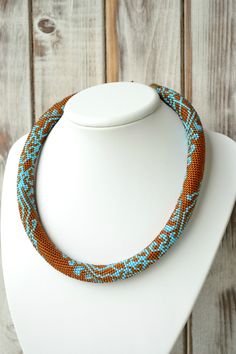 "Amber necklace with turquoise lace pattern... ♡I promise that you will always be in the spotlight with such necklace!♡ SIZE Length: 19 inches (48 cm) ❤ CUSTOM ORDERS It is ABSOLUTELY HANDMADE . So if you like this item in a different color or size, send me a message please. I will send you a link for a \"custom order\" and you'll be able to place the order there. Please feel free to communicate with me. More beautiful necklaces https://www.etsy.com/ru/shop/UkrainianJewelryShop?ref=listing-shop2 Bohemian Brown Crochet Jewelry, Brown Bohemian Crochet Jewelry, Beaded Crochet Necklace, Necklace Rope, Turquoise Lace, Beaded Crochet, Chocker Necklace, Necklace Turquoise, Amber Necklace