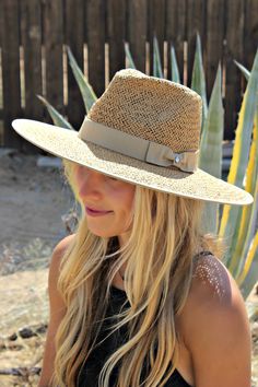 Our Palm Desert Panama fit in perfectly on our latest road trip photo shoot. Stunning, classic, chic - everything you've ever wanted in a hat. Featuring a molded crown with a pinched 10cm brim and hand woven straw, it's crystallized on the tone on tone ribbon with a simple Swarovski rivet. -Rancher style hat with a chill & casual vibe-Brim is flexible but holds its shape-Coordinating ribbon band-Pinched top-Great quality-- will last forever-This color actually goes with everything effortless Straw Panama Hat, Beach Hats, Vacation Planner, Palm Desert, Tone On Tone, Classic Chic, Beach Hat, Country Girl, Hat Band