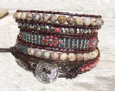 Leather Wrap Bracelet  Bohemian Jewelry Southwest Bracelet Brown Wrap Bracelet Leather Jewelry Hippie Wrap Brown Purple Wrap  Bracelet Gorgeous leather 5 wrap bracelet with stunning 6 mm Mafian stone beads, dark rosewood seed beads, silver diamond cut  beads on dark brown leather. The bracelet features mix of different beading patterns, inspired of famous Chan Luu style. Beautiful metallic closure completes the unique look of this mysterious bracelet! Bracelet length is 37 inches (94 cm) without Bohemian Brown Leather Bracelet, Southwestern Brown Bracelets, Southwestern Hand-wrapped Wrap Bracelet For Gift, Southwestern Hand Wrapped Wrap Bracelet Gift, Southwestern Style Hand Wrapped Wrap Bracelet Gift, Bohemian Brown Bracelets As Fashion Accessory, Brown Bohemian Beaded Bracelet, Red Adjustable Leather Bracelet, Bohemian Style, Multicolor Leather Bracelet In Bohemian Style