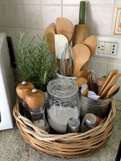 a basket filled with lots of kitchen utensils