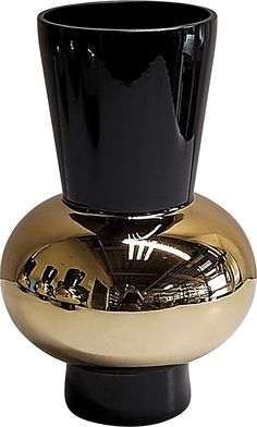 a black and gold vase sitting on top of a table