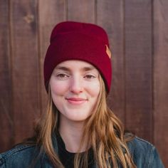 Stay cozy and stylish with our Three Tree Fold Over Beanie in Burgundy. This beanie features a fold-over design and our signature suede patch of three trees. Keep your head warm while adding a touch of color to your look. Winter just got a whole lot cooler! One size fits all. A Montana Scene Original Design. All designs are property of The Montana Scene. All rights reserved.All of The Montana Scene apparel is designed and printed locally in Montana. Come visit our storefront locations! Bigfork * Cozy Hats With Fleece Lining For Fall, Solid Cotton Hat For Fall, Cozy Red Beanie For Fall, Adjustable Beanie For Cold Weather In Fall, Comfortable Beanie For Outdoor Fall Activities, Fall Outdoor Beanie With Fleece Lining, Casual Fall Beanie With Fleece Lining, Outdoor Fall Beanie With Fleece Lining, Comfortable Fall Beanie In Solid Color