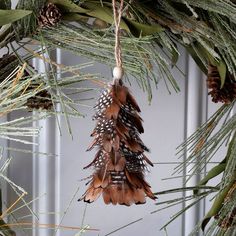 Natural mini pheasant feather tree ornament for sale. Buy hand crafted feather products to use for carnival, mardi grass, halloween, special event and home decor, cultural dance performance and more. Pheasant Feather Decor, Feather Christmas Tree, Hunting Crafts, Feather Crafts Diy, Feather Wreath, Pheasant Feather, Special Events Decor, Feather Decor, Owl Ornament