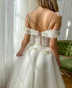 the back of a woman's wedding dress