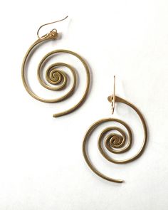 In these bronze or sterling silver plated earrings, the beauty of the universe intertwines with the artistry of the human hand. A crowd favorite, classic Lochlin Smith design. The larger sibling to our Spiral Galaxy Earrings. Length includes earwires. Earwires are 14/20 gold filled or sterling silver depending on color. Artistic Bronze Jewelry With Ear Wire, Unique Spiral Earrings, Handmade Vintage Spiral Jewelry, Unique Swirl Earrings As Gift, Unique Swirl Earrings For Gifts, Gold Spiral Earrings Made Of Copper, Adjustable Symbolic Spiral Jewelry, Symbolic Adjustable Spiral Jewelry, Unique Spiral Earrings For Gift