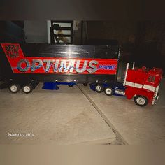 two toy trucks that are sitting on the floor