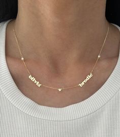 This adorable mini name necklace now comes with diamonds in between each name! Price is based on how many names you enter. Goes up as you enter more names. Example: if entering 4 names, select 4 for # of names. If you want to order one with a date, please use dashes ONLY in between the numbers. EXAMPLE: 14K Yellow Gold, 3 names, 4 diamonds - $1600 Name #1: zoey Name #2: max Name #3: jagger 2 names: 1 or 3 diamonds - if 1 it will be in between the name, if 3 it will be on every side of the names Two Name Necklace, White Diamond Nameplate Necklace, Anniversary White Gold Name Necklace, Customized Diamond Name Necklace, Customized Elegant Diamond Name Necklace, Diamond Nameplate Necklaces, Custom Name Diamond Necklace For Anniversary, White Name Necklace For Anniversary, Personalized Nameplate Diamond Necklace For Anniversary