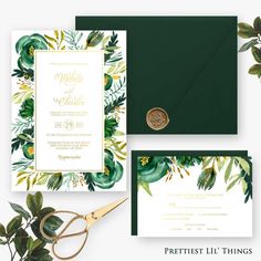 wedding stationery with greenery and gold foil on the front, green envelope, and white card