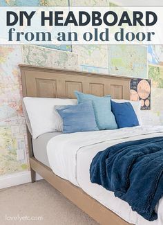 a bed with blue and white pillows in a bedroom next to a map on the wall