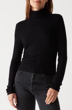 You can rely on this soft and stretchy narrow-ribbed turtleneck for classic good looks no matter what you pair it with. 24" length Turtleneck Long sleeves 97% Lenzing™ EcoVero™ viscose, 3% Lycra® spandex Lenzing EcoVero viscose is a more-sustainably produced fiber made using pulp made from renewable wood sources Machine wash, tumble dry Made in the USA Fitted Mock Neck Top For Fall, Fitted Fine Knit Mock Neck Top, Fitted Versatile Mock Neck Top For Fall, Fitted Ribbed Mock Neck Turtleneck Top, Sleek Fall Tops With Minimal Stretch, Sleek Tops With Minimal Stretch For Fall, Sleek Tops For Fall With Minimal Stretch, Sleek Turtleneck For Fall, Fitted Ribbed Turtleneck Top