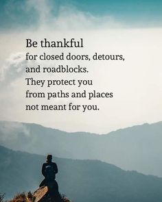 a person sitting on top of a mountain with a quote above it that says be grateful for closed doors, detours, and roadblocks