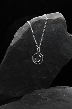 Moon necklace, Sterling Silver necklace, Moon pendant, Half-moon pendant, Minimalist necklace, Witch talisman, Practical magic This elegant moon necklace has been hand-made using 925 sterling silver.  I creat this pendant for amazing people who are in love with the Moon. The minimalist necklace would make a wonderful, personal gift! It's light, simple, and yet elegant, and it is beautifully made. Your order will be sent out with a gift box and if you're giving it as a gift I can include a person Cool Pendants For Men, Celestial Moon Shaped Necklace With Moon Print, Minimalist Moon Charm Round Pendant Necklace, Minimalist Moon Charm Necklace With Round Pendant, Spiritual Crescent Moon Phase Charm Necklace, Moon Shaped Necklace With Moon Print For Gift, Moon Print Necklace Perfect For Gifts, Moon Print Moon-shaped Necklace Gift, Moon Print Moon Shaped Necklace For Gift