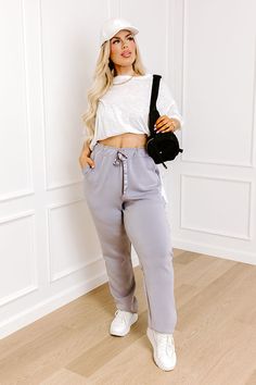 - These cozy pants are athleisure but better with a touch of luxe vibes! - Unlined material - Satin finished accent stripes down the sides of the pant legs - A stretchy elastic waistband with a functional satin finished drawstring - Functional side pockets - A relaxed silhouette that ends in straight hemlines Gray Stretch Sweatpants For Loungewear, Trendy Gray Joggers With Elastic Waistband, Athleisure Gray Pants With Ribbed Waistband, Trendy Gray Joggers For Leisure, Gray Bottoms With Ribbed Waistband For Lounging, Gray Lounging Bottoms For Fall, Gray Athleisure Bottoms With Ribbed Waistband, Trendy Gray Sweatpants For Loungewear, Gray Athleisure Bottoms For Fall