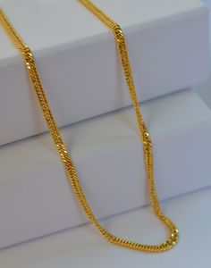 Elevate your everyday style with this exquisite dainty Kihei gold chain necklace, also known as a Japan chain. Crafted with precision, this delicate yet durable piece is perfect for adding a touch of sophistication to any outfit. -Material: 18 k Solid Gold -Necklace Length: 18" -       Chain Width: 2.7 mm PRODUCTION AND SHIPPING PROCESS -Ready to ship in 1-2 days. -Shipping through usps 1-5 days PERFECT GIFT -Your Jewelry comes in a lovely gift box. -If you are gifting this to a loved one, be sure to send us a message. A personal note would add a wonderful touch. Lock Design, Solid Gold Necklace, Everyday Accessories, Gold Chain Necklace, Necklace Length, Everyday Style, Lovely Gift, Gold Chain, Chains Necklace