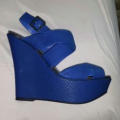 Royal Blue Brand New Never Worn Wedge Shoe Trendy Blue Wedge Sandals For Spring, Trendy Blue Wedge Sandals With Round Toe, Blue Platform Sandals With Closed Toe, Blue Platform Heels In Synthetic Material, Blue Closed Toe Platform Sandals, Blue Closed Toe Wedge Sandals For Spring, Trendy Blue Synthetic Wedge Sandals, Blue Synthetic Wedge Sandals For Spring, Blue Platform Sandals For Vacation