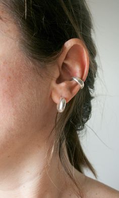 Chunky conch cuff. Handcrafted from sterling silver 925, this beautiful bold chunky ear cuff will complete your everyday outfit without any need of getting your ears. The price is for one cuff. See my whole jewelry collection here--> https://www.etsy.com/shop/SosyGallery Follow Sosy Gallery on Instagram @sosy_gallery Twitter--> https://twitter.com/sosygallery Facebook--> https://www.facebook.com/sosygallery https://gr.pinterest.com/sosygallery/ Silver Cuff Earrings, Etsy Silver Earrings, Chunky Ear Piercings, Cool Conch Earrings, Ear Party Piercings, Conch Cuff Piercing, Cool Silver Earrings, Silver Conch Piercing, Bold Silver Jewelry