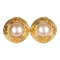 These 93P Vintage Pearl Round CC Button Earrings are in faux pearl and 24K gold plated metal, feature a round faux pearl in the center with gold trim, four CC's surrounding the pearl, and has a clip on back closure. Origin: FranceCondition: Vintage; Excellent - Minor scratches and discoloration to earrings. Accompanied by: Chanel boxMeasurements: 1.25" height x 1.25" width Chanel Pearl, Neverfull Mm Monogram, Chanel Pearls, Burberry Shoes, Vintage Pearl, Chanel Jewelry, Button Earrings, Vintage Louis Vuitton, Vintage Pearls