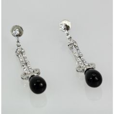 This is part of Chairish’s Fine Jewelry assortment.  These lovely earrings are set with round Diamonds, baguette Diamonds and pave Diamonds all with an Onyx drop. They are 2 1/4" long, Onyx is 9.17cm wide x 12.55cm long and weight 11.9 grams. These earrings are from Spain and the setting is gorgeous, baguettes alternate between round Diamonds with a pave of Diamonds heading the Onyx. Perfect you will keep these in your collection forever. I love black onyx and I do have a few important pieces bu I Love Black, Baguette Diamonds, Love Black, Lovely Earrings, Baguette Diamond, Long Earrings, Pave Diamonds, Black Onyx, Round Diamonds