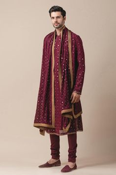 Wine front-open sherwani with all-over mukaish work. Comes with embroidered kurta, stole, unstitched jutti fabric and churidar. 
Component: 5
Embroidered
Neckline: Mandarin Collar
Sleeve Length: Full
Fabric: Georgette, Poplin Lycra
Color: Maroon
Concealed front placket
Lace trims
 - Aza Fashions Mukaish Work, Embroidered Sherwani, Tarun Tahiliani, Embroidered Neckline, Lace Trims, Churidar, Kurta Set, Designer Wear, Mandarin Collar