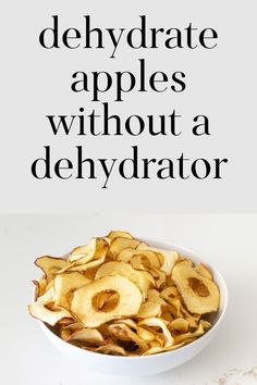 a bowl filled with sliced apples sitting on top of a white counter next to an apple peel