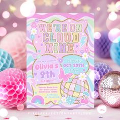 we're on cloud nine birthday party with pink, blue and gold decorations around it