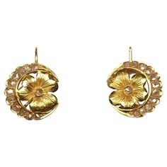 Floral design Art Nouveau earrings set in gold with rose cut diamonds. Lever back fastening. Highlights - Gold 18ct - Rose cut diamonds - Art Nouveau period 1900s c.a. Measurements - Diameter 1.4cm - Weight 4.5gr