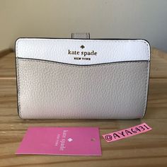 100% Authentic Kate Spade K6396 Leila Colorblock Medium Compact Bifold Wallet Light Sand And Gold Hardware **Brand New With Tags** 5 3/4” L X 3.5” H Cream Bifold Wallet With Interior Card Slots, Cream Leather Bifold Wallet, Elegant White Compact Wallet, White Rfid Blocking Rectangular Wallet, White Rectangular Kate Spade Wallet, Kate Spade White Leather Wallet, White Kate Spade Bags With Card Slots, White Rfid Blocking Wallets, Modern White Wallet With Rfid Blocking