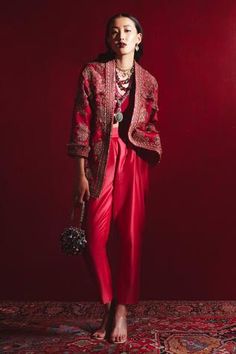 Cherry red jacket with floral embroidered motifs and fringe detail. Comes with bustier and straight pants.
Component: 3
Pattern: Embroidery
Type Of Work: Thread, Sequin and Cutdana
Neckline: V neck
Sleeve Type: Full
Fabric: Raw Silk and Fine Silk
Color: Red
Other Details: 
Embroidered jacket
Note: Necklace and bag carried by the model is not for sale
Occasion: Destination Wedding - Aza Fashions Velvet Jacket Women, Red Jacket Outfit, Red Velvet Jacket, Indian Jackets, Ridhi Mehra, Desi Clothes, Silk Outfit, Red Thread, Silk Trousers