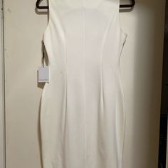 Beautiful Winter White Career Dress. Zipper Feature Is Not Just For Show, They Are Functional. The Dress Is A Poly-Rayon- Spandex Blend, Heavy Weight. Dress Is Below The Knee On My 5’3” Frame, But Is Not True Midi Length. Dress Was Never Worn, It’s Always Been A Bit Too Big. I Saved In Case I Gained Eight Because I Love This Dress. I Hope You Will Love It And Wear It White Bodycon Mini Dress With Back Zipper, Fitted White Bodycon Dress With Back Zipper, White Stretch Lined Dress, Stretch Sheath Midi Dress With Lining, White Bodycon Dress With Back Zipper, White Sleeveless Stretch Midi Dress, White Elastane Formal Dress, Formal White Elastane Dress, White Sleeveless Elastane Dress