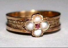 A beautiful Georgian memorial ring. Tests as 18k yellow gold. Represents a love lost. Set with hair around the band which is a symbol of a memory. Originally purchased in the UK. Set with 4 pearls and a central ruby. Currently a size 6 1/2- 6 3/4. A truly beautiful Georgian piece in excellent condition and very special. Georgian Engagement Ring, Jewelry Smithing, Ruby Hair, Vintage Eternity Band, Baguette Band, Georgian Ring, Baguette Diamond Band, Memory Of A Loved One, Love Lost