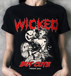 Unleash your wicked side with our 'Wicked But Cute' unisex tee! This vintage goth t-shirt combines edgy style with a touch of charm. You'll feel fierce and adorable at the same time. Who says you can't have it all? . Wicked But Cute Unisex T-shirt. 100% combed ringspun cotton· Light fabric· Premium fit· Runs bigger than usual· Original design Care Instructions: Machine wash cold. Do not bleach. Tumble dry low. Edgy Halloween T-shirt For Alternative Fashion, Distressed Black T-shirt For Alternative Fashion, Black Distressed T-shirt For Alternative Fashion, Edgy Halloween Concert T-shirt, Edgy T-shirt For Halloween, Emo Halloween Concert T-shirt, Gothic Halloween Concert T-shirt, Alt Goth, Vintage Goth